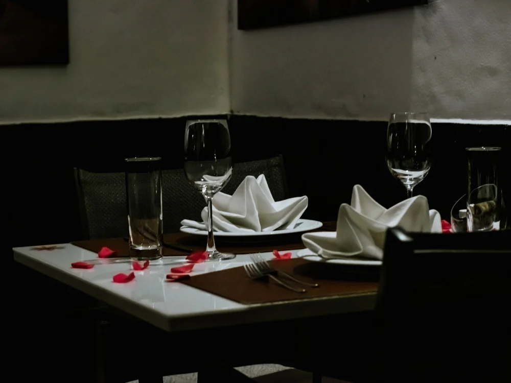 A table set for dinner before a show, representative of a Paris cabaret evening